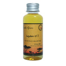 "Applying African Traditional Handmade Layden Oil Hot Hair treatment"